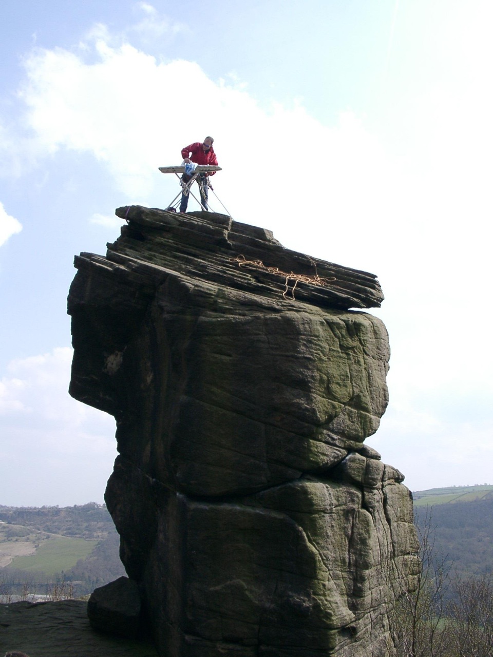 man ironing on canyon rock formation