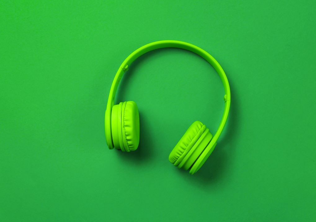 Image of green headphones against a green background