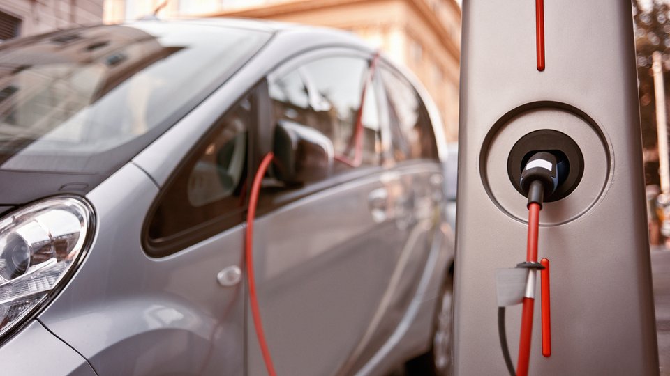 Movie poster featuring e-vehicle charging.