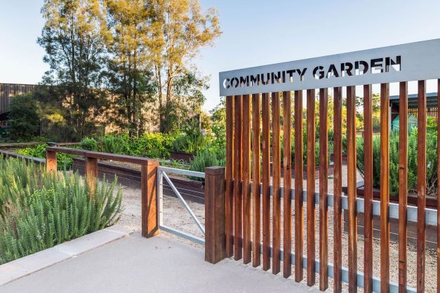 Image of the St Lucia Community Garden entrance at sunset