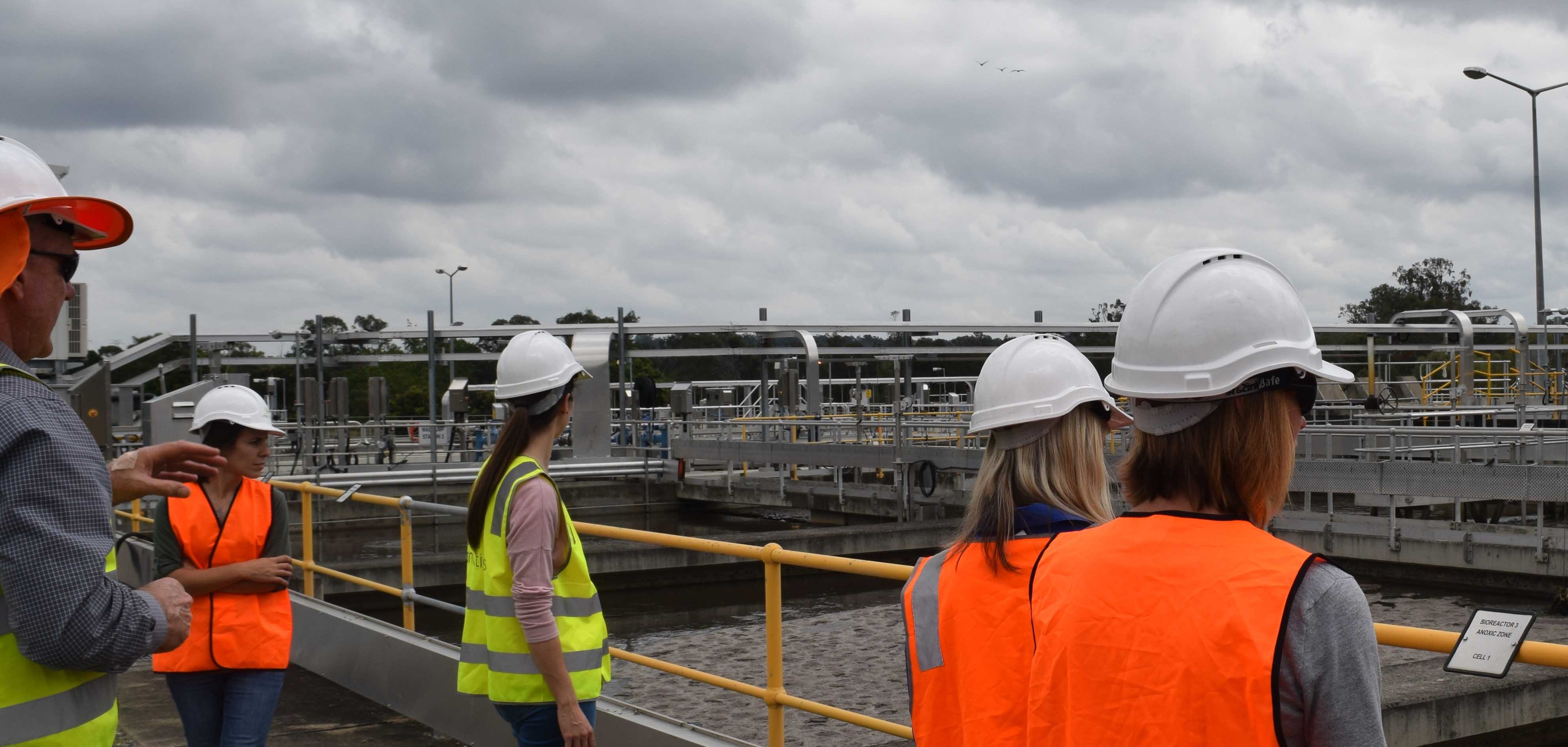 Green Labs representatives inspecting aerated water tanks at water treatment facility