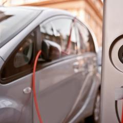 Movie poster featuring e-vehicle charging.