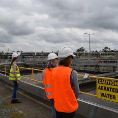 Green Labs representatives inspecting aerated water tanks at water treatment facility