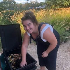 Georgia, President of the UQ Community Garden Club, with the club's worm farm