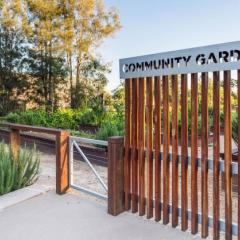 Image of the St Lucia Community Garden entrance at sunset