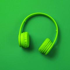 Image of green headphones against a green background